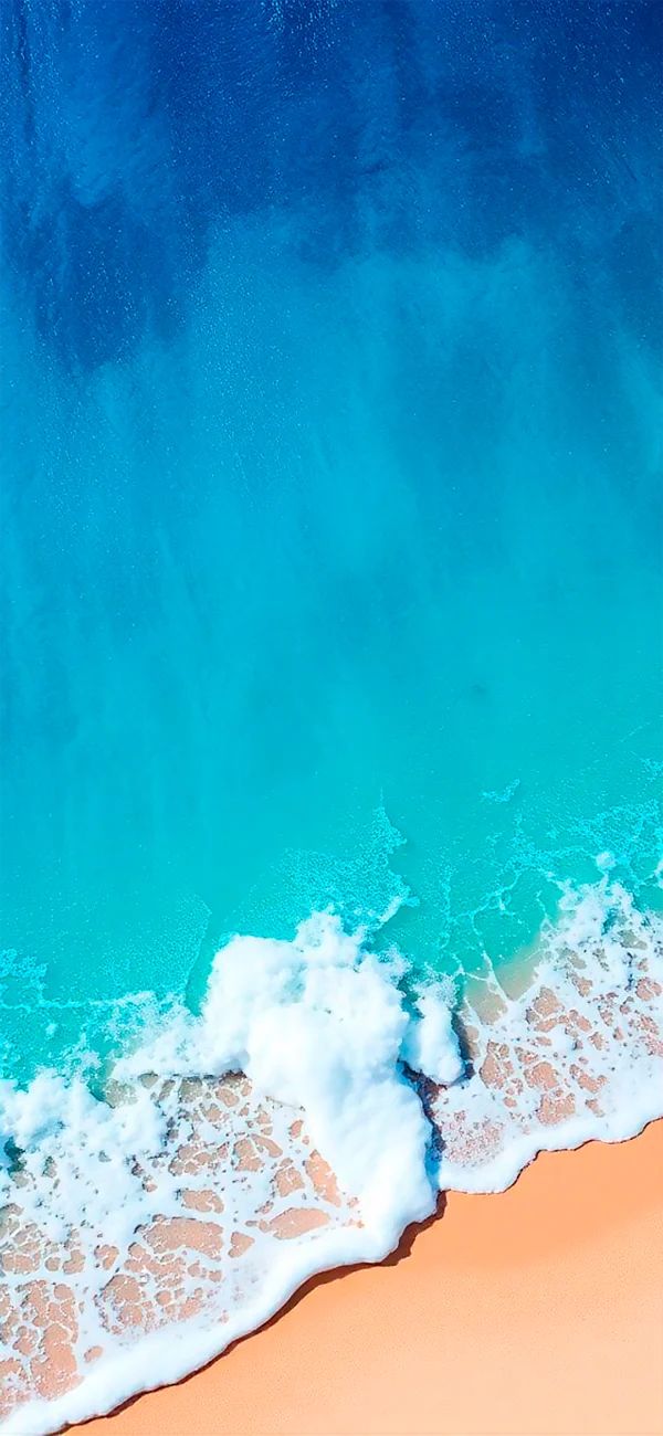 View from above of the sandy ocean wallpaper