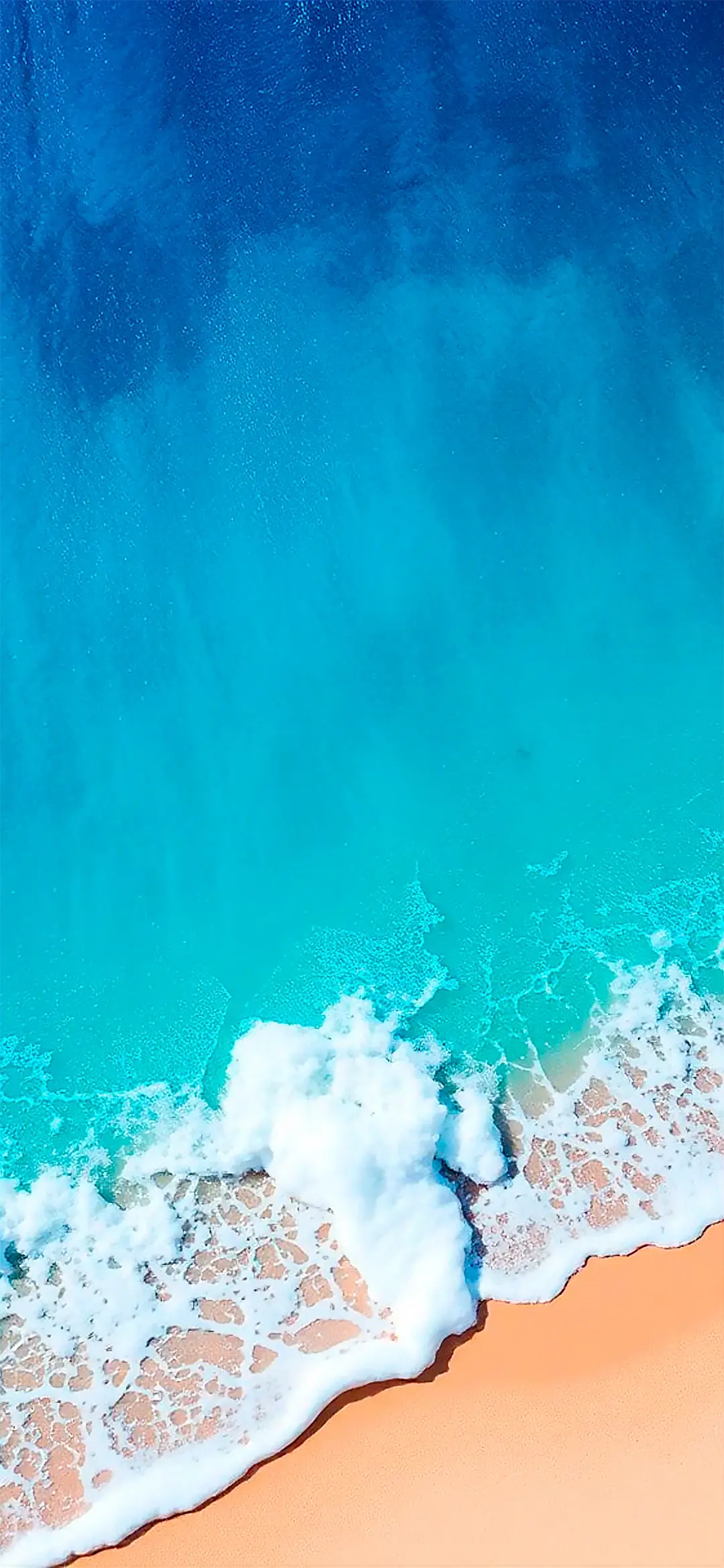 View from above of the sandy ocean wallpaper